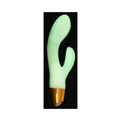 Glow-in-the-dark silicone rabbit vibrator with curved shaft and textured tip, featuring a gold base and dual motors.