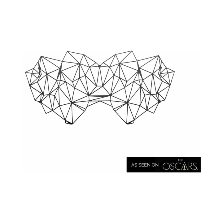 Black geometric decal eyemask with angular lines and shapes, designed for a sleek, modern look.