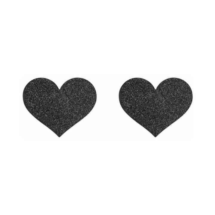 Pair of black glitter heart-shaped adhesive pasties on a white background for stylish body decoration.