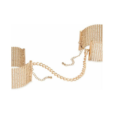 Gold-tone metal mesh handcuff bracelets connected by a delicate adjustable chain clasp.