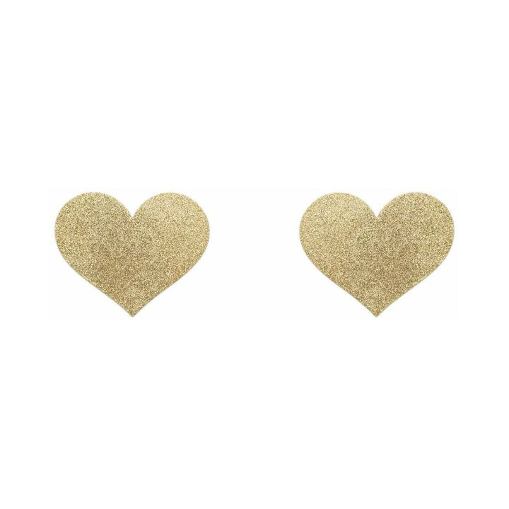 Pair of gold glitter heart-shaped adhesive pasties on white background