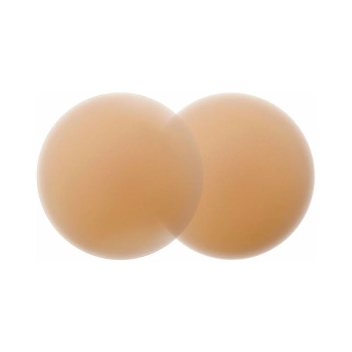 Pair of round caramel-colored reusable silicone nipple covers with a smooth matte finish.