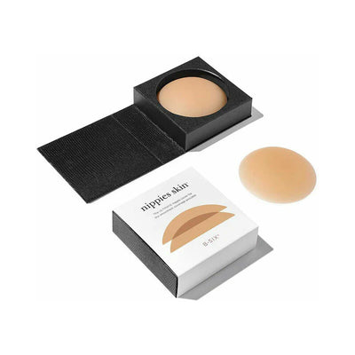 Reusable caramel-colored silicone nipple covers with sleek black storage case and packaging box.