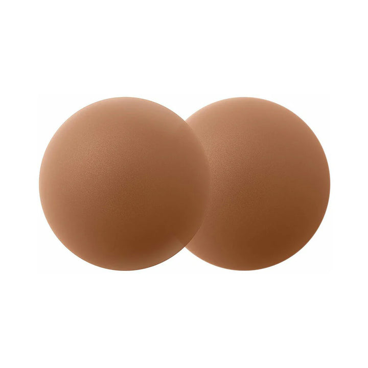 Pair of smooth, matte cocoa-colored reusable silicone nipple covers for discreet, comfortable wear.