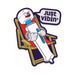 Colorful enamel pin of a relaxed cartoon wand vibrator lounging on a chair with a speech bubble saying Just Vibin'
