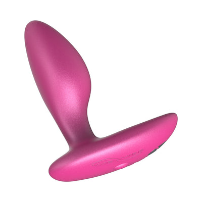 Pink silicone We-Vibe Ditto+ rechargeable vibrating anal plug with ergonomic shape and control buttons.