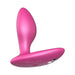 Pink silicone We-Vibe Ditto+ rechargeable vibrating anal plug with curved shape and control buttons.