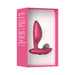 Pink silicone We-Vibe Ditto+ vibrating anal plug displayed in white and pink retail packaging.