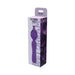 Purple silicone clitoral vibrator with flower petal design in branded packaging box.