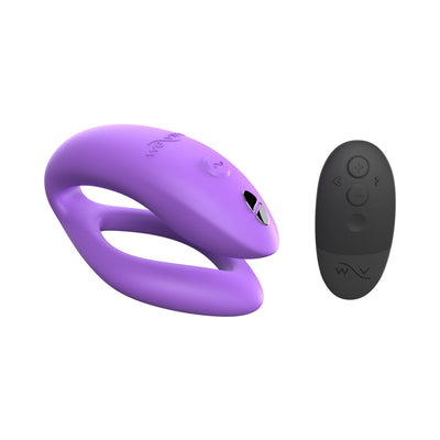 Purple We-Vibe Sync O couples vibrator with black remote control on white background.