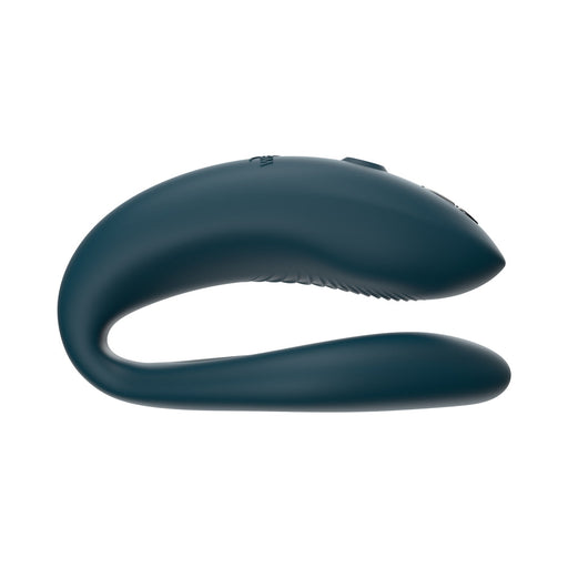 Dark teal flexible silicone We-Vibe Sync O couples vibrator with curved, adjustable O-shaped design.