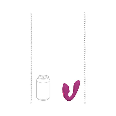 Compact purple silicone triple motor vibrator with curved design shown next to soda can for size comparison.