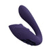Purple rechargeable triple motor vibrator with curved design and control buttons on base.