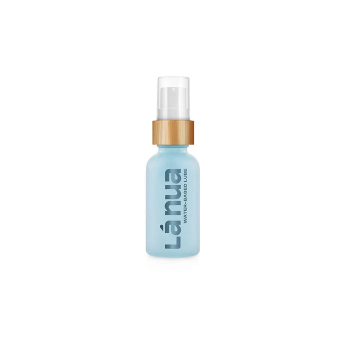 La Nua water-based lubricant in a light blue bottle with a wooden-textured pump dispenser.