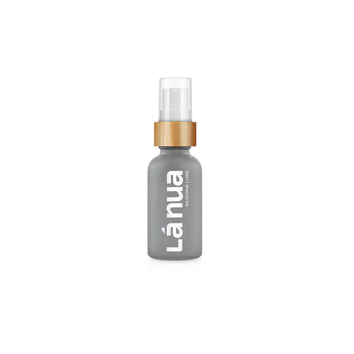 Gray La Nua silicone lubricant bottle with wooden pump dispenser and white text on front