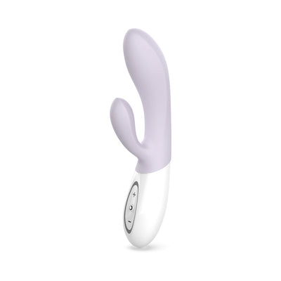 Purple dual-stimulation rabbit vibrator with ergonomic curves and white handle featuring control buttons.