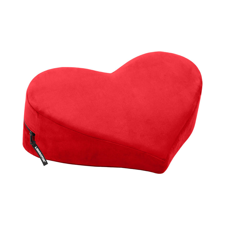 Red heart-shaped wedge pillow with soft velvish cover and zipper, designed for comfortable positioning and support.