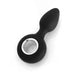 Black rechargeable silicone anal plug with ergonomic shape and silver ring handle on a white background.