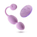 Lilac Wellness Raine vibrating kegel ball with curved design and matching wireless remote control on white background.