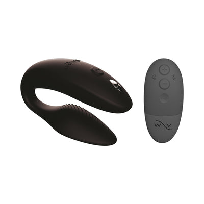Satin black We-Vibe Sync 2 couples vibrator with textured arms and matching remote control on white background.