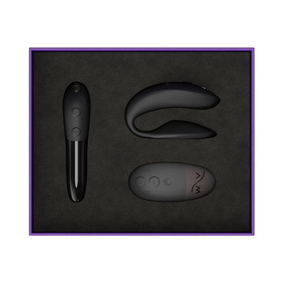 We-Vibe 15 Year Anniversary Collection set with satin black Sync 2 couples vibrator, Tango X bullet vibrator, and remote in purple box.