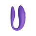 Purple We-Vibe Sync Go couples vibrator with ergonomic design and textured inner arms on white background.