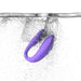 Purple We-Vibe Sync Go couples vibrator submerged in water with bubbles, highlighting its waterproof feature.