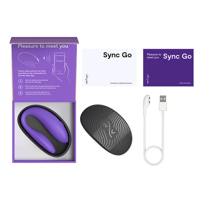 We-Vibe Sync Go couples vibrator in purple with black travel case, USB charging cable, and user manuals on white background.