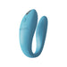 Blue We-Vibe Sync Go couples vibrator with ergonomic design and textured inner arm on white background.