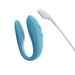 Blue We-Vibe Sync Go couples vibrator with textured inner arm and white magnetic charging cable.