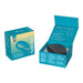 We-Vibe Sync Go couples vibrator in teal with packaging box and black travel case displayed inside open box