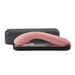 Elegant curved pink personal massager with smooth finish resting in a sleek black storage case.