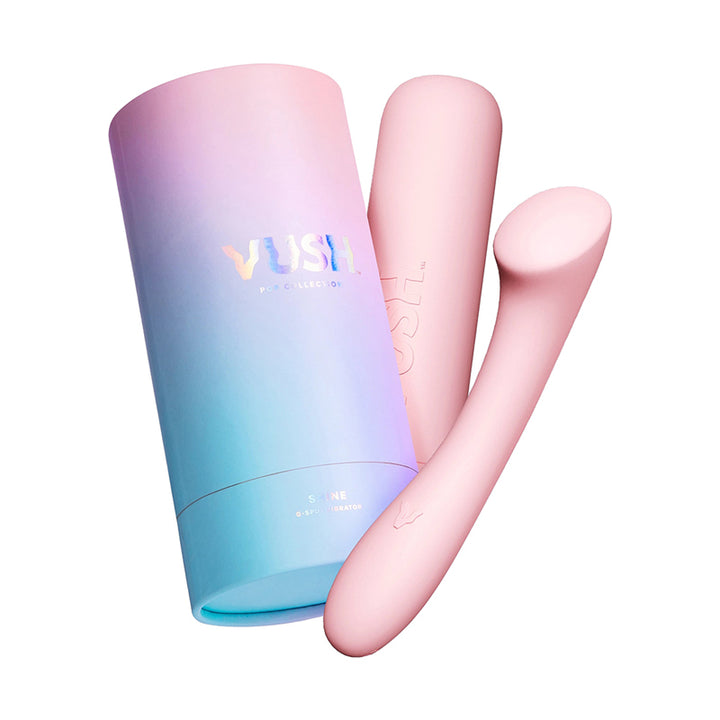Pink VUSH Shine G-Spot Vibrator with sleek curved design next to pastel gradient blue and pink packaging tube