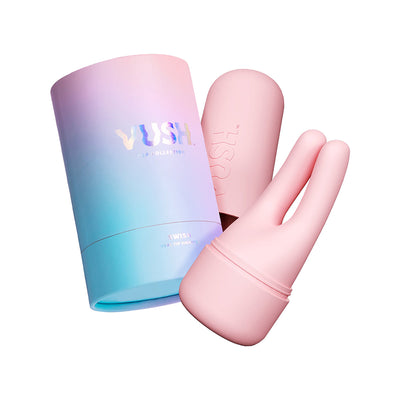 Pink dual tip vibrator with matching protective cover and gradient pastel blue to pink packaging tube.