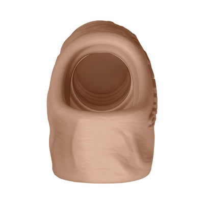 Close-up view of the flexible, flesh-toned Shaft Model F sheath with a smooth, rounded opening and textured interior.