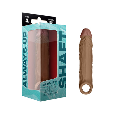 Model F Shaft Sheath Size 1 in brown FLEXISKIN™ liquid silicone with realistic texture and open ring base, shown with packaging.