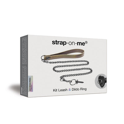 Strap-On-Me Leash and Dildo Ring Kit packaging featuring a leather wrist strap and metal chain with attachment ring.