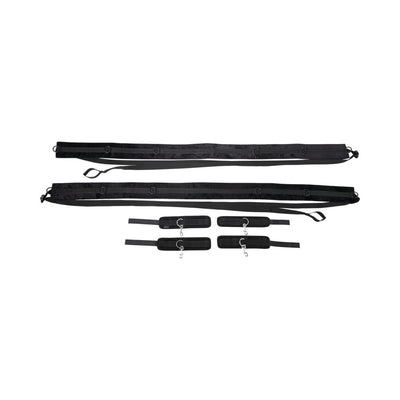 Black adjustable restraint straps with four padded cuffs and metal D-ring connectors laid out on white background.