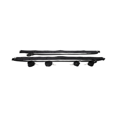 Black adjustable restraint system with padded cuffs and multiple D-ring connectors for versatile positioning.
