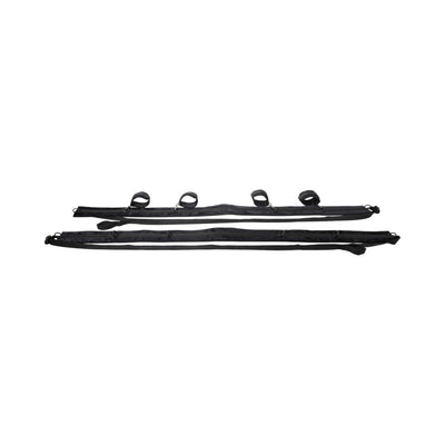 Black adjustable restraint system with padded cuffs and multiple D-ring connectors for versatile positioning.
