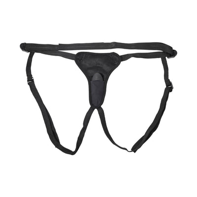 Black adjustable strap-on harness with front padded pocket holding a removable vibrator.