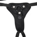 Black adjustable strap-on harness with front padded panel and metal snap buttons for secure fit.