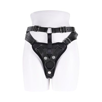 Black high-waisted adjustable strap on harness with reinforced O-ring and buckle details on white mannequin.