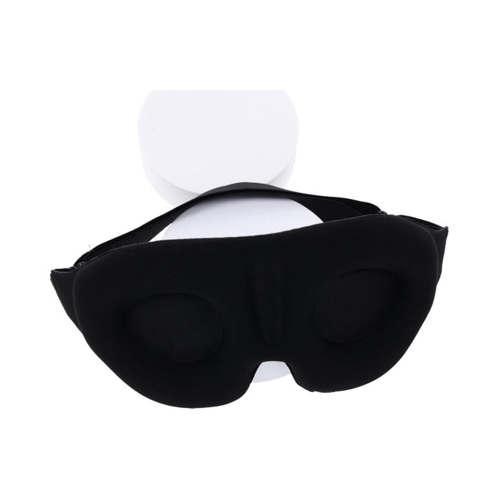 Black Sportsheets Blackout Blindfold with contoured memory foam and adjustable elastic strap on white display stand.