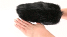 Black faux fur sensory mitt with hidden spikes, shown on hand for size and texture demonstration.