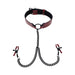 Red and black adjustable collar with attached black chains and red-tipped nipple clamps for intimate play.