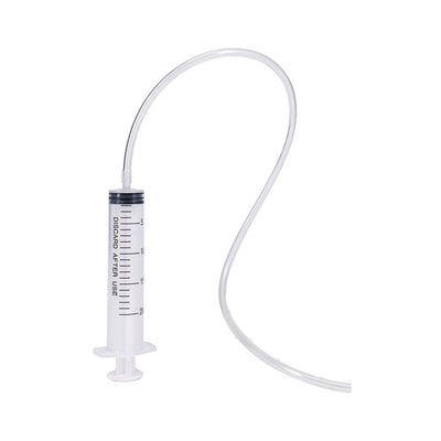 Clear plastic syringe with attached flexible tubing for squirting feature in adult toy.