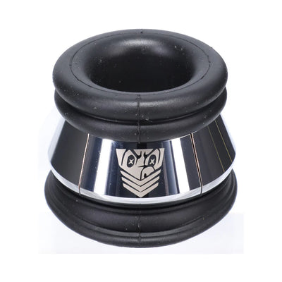 Black silicone and polished metal ring with engraved emblem, designed for comfort and support in intimate wear.