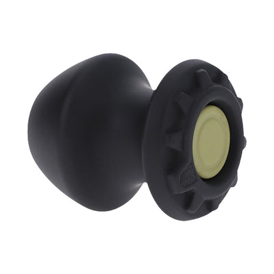 Small black silicone Kum Keeper with tapered tip and removable stopper for secure liquid retention.