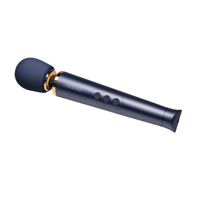 Le Wand Petite rechargeable massager in sleek violet with gold accents and control buttons on handle.